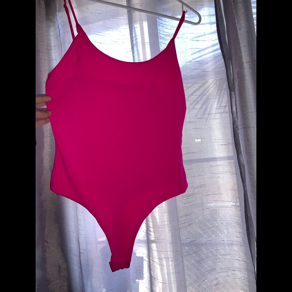 Neon pink body suit